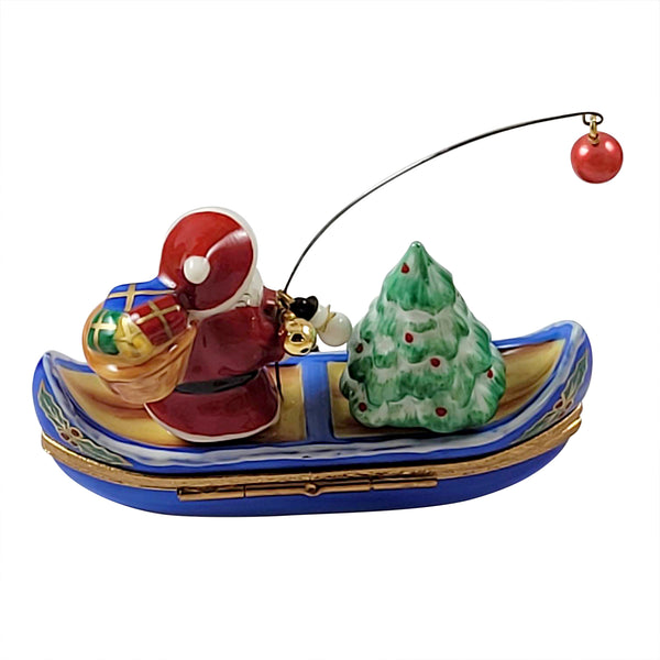 Load image into Gallery viewer, Santa with Tree in Canoe Limoges Box
