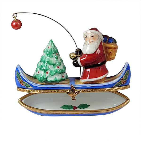 Load image into Gallery viewer, Santa with Tree in Canoe Limoges Box
