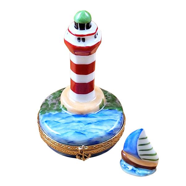 Load image into Gallery viewer, Rochard "Hilton Head Lighthouse with Removable Porcelain Sailboat" Limoges Box
